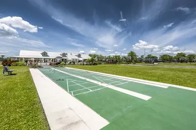 shuffleboard and clubhouse at Resort at Canopy Oaks